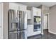 Well-equipped kitchen with stainless steel refrigerator and built-in oven, optimizing space and style at 281 Dovetree Dr, Danville, IN 46122