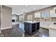 Open-concept kitchen featuring a large island and seamless flow into the living area at 281 Dovetree Dr, Danville, IN 46122