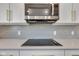 Modern kitchen showcasing stainless steel appliances and sleek gray subway tile backsplash at 281 Dovetree Dr, Danville, IN 46122