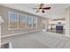Bright living room with large windows providing ample natural light and views of the backyard at 281 Dovetree Dr, Danville, IN 46122