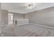 Spacious upstairs loft area with plush carpeting, perfect for use as a playroom, office, or den at 281 Dovetree Dr, Danville, IN 46122