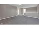 Upstairs loft with soft carpeting and neutral walls offers flexible space for relaxation or recreation at 281 Dovetree Dr, Danville, IN 46122