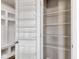 Organized pantry with adjustable shelving for efficient storage in a home's mudroom and storage area at 281 Dovetree Dr, Danville, IN 46122