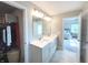 Bright bathroom boasts double sinks, quartz countertops, and a large mirror above the vanity at 3535 Merchmont Rd, Bargersville, IN 46106