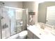 Bathroom features a glass-enclosed shower, a vanity with countertop space, and a modern sink at 3535 Merchmont Rd, Bargersville, IN 46106