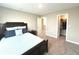 Cozy bedroom featuring a dark wood frame bed with blue and white pillows at 3535 Merchmont Rd, Bargersville, IN 46106