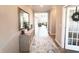 Inviting entryway with console table, mirror, rug, and view to a living room at 3535 Merchmont Rd, Bargersville, IN 46106