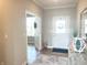Welcoming foyer with a decorative rug, console table, and doorway leading to another room at 3535 Merchmont Rd, Bargersville, IN 46106