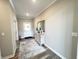 Inviting foyer with hardwood floors, decorative rug, console table with mirror, and ample natural light at 3535 Merchmont Rd, Bargersville, IN 46106