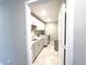 Well-lit laundry room with modern appliances and ample storage space for convenience and organization at 3535 Merchmont Rd, Bargersville, IN 46106