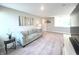 Cozy living room is spacious with an accent wall and a comfortable blue couch for relaxing at 3535 Merchmont Rd, Bargersville, IN 46106