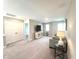 Spacious bonus room with neutral carpet, entertainment center, and comfortable seating, perfect for relaxation at 3535 Merchmont Rd, Bargersville, IN 46106