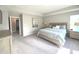 Serene main bedroom suite featuring a king-size bed, neutral tones, and plenty of natural light at 3535 Merchmont Rd, Bargersville, IN 46106