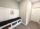 Mud room features built-in seating, storage baskets, and coat hooks for added convenience and organization at 3535 Merchmont Rd, Bargersville, IN 46106