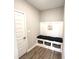 Cozy mud room features built-in seating with storage baskets, perfect for organization and convenience at 3535 Merchmont Rd, Bargersville, IN 46106