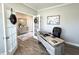 Home office featuring a modern desk, French doors, and wood-look flooring at 3535 Merchmont Rd, Bargersville, IN 46106