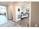 Bright home office with light wood floors, modern desk, and double glass doors at 3535 Merchmont Rd, Bargersville, IN 46106