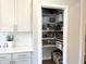 Pantry with white shelves that provide ample storage for all your food and kitchen essentials at 3535 Merchmont Rd, Bargersville, IN 46106
