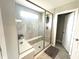 Modern shower features glass doors, a built-in bench, and elegant tile work, offering a spa-like experience at 3535 Merchmont Rd, Bargersville, IN 46106