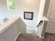 Carpeted staircase with white risers leads to upper level, artwork provides a focal point, and a natural light filled space at 3535 Merchmont Rd, Bargersville, IN 46106