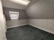 Finished attic bedroom with neutral paint, and dormer window at 367 W Broadway St, Shelbyville, IN 46176