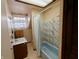 Modest bathroom featuring a vanity, and tub with shower at 367 W Broadway St, Shelbyville, IN 46176