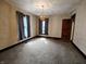 A cozy bedroom featuring soft carpet, natural light from the windows, and neutral walls at 367 W Broadway St, Shelbyville, IN 46176