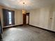 Bedroom with carpet, warm lighting, and natural light showcases a serene space at 367 W Broadway St, Shelbyville, IN 46176