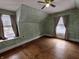 Bedroom featuring natural light, unique wallpaper and hard wood floors at 367 W Broadway St, Shelbyville, IN 46176