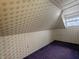A bedroom with rainbow wallpaper and purple carpet at 367 W Broadway St, Shelbyville, IN 46176