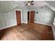 Bedroom with vintage hard wood floors, two entry ways, and ceiling fan at 367 W Broadway St, Shelbyville, IN 46176
