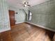 Bedroom with vintage hard wood floors, natural light, and ceiling fan at 367 W Broadway St, Shelbyville, IN 46176