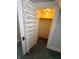 Open closet with patterned wallpaper and door-mounted shoe rack at 367 W Broadway St, Shelbyville, IN 46176