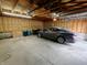 Garage with a gray car parked inside, showcasing its ample space at 367 W Broadway St, Shelbyville, IN 46176