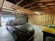 The garage features natural wood walls and a car parked inside at 367 W Broadway St, Shelbyville, IN 46176