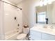 Bright bathroom featuring a shower/tub combination and a white vanity with solid surface countertops at 3865 Kensington Dr, Danville, IN 46122