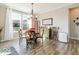 Cozy eat-in dining area with natural light, elegant chandelier, hardwood floors and comfortable seating at 3865 Kensington Dr, Danville, IN 46122