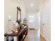 Inviting entryway featuring a decorative console table, mirror, and stylish lighting at 3865 Kensington Dr, Danville, IN 46122