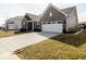 Brick home with a well-maintained lawn and driveway, offering a welcoming view at 3865 Kensington Dr, Danville, IN 46122