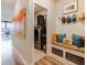 Cozy hallway featuring a washer/dryer closet, and a coat and shoe drop-off station at 3865 Kensington Dr, Danville, IN 46122