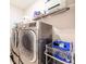 Washer and dryer on display with plenty of organization and storage space at 3865 Kensington Dr, Danville, IN 46122