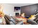Living room with hardwood floors, fireplace and stylish gray couches at 3865 Kensington Dr, Danville, IN 46122