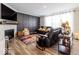 Cozy living room with a fireplace, comfortable seating, and stylish decor at 3865 Kensington Dr, Danville, IN 46122