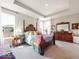 Spacious main bedroom with a bed, sitting area, dresser, and plenty of natural light at 3865 Kensington Dr, Danville, IN 46122