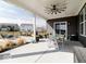 Covered patio featuring a ceiling fan and outdoor seating, great for entertaining at 3865 Kensington Dr, Danville, IN 46122