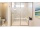 Bathroom with a glass enclosed shower with a built-in seat and tiled walls at 3865 Kensington Dr, Danville, IN 46122