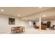 Spacious finished basement with an open floor plan, dining area, sitting area, neutral carpet, and recessed lighting at 405 Letterman Dr, Brownsburg, IN 46112