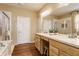 Bathroom with double vanity, wooden cabinets, and separate shower and tub at 405 Letterman Dr, Brownsburg, IN 46112