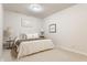 Comfortable bedroom featuring a cozy bed with plush pillows, soft lighting, neutral walls, and carpet at 405 Letterman Dr, Brownsburg, IN 46112