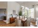 Elegant dining room featuring hardwood floors, a chandelier, and large windows at 405 Letterman Dr, Brownsburg, IN 46112